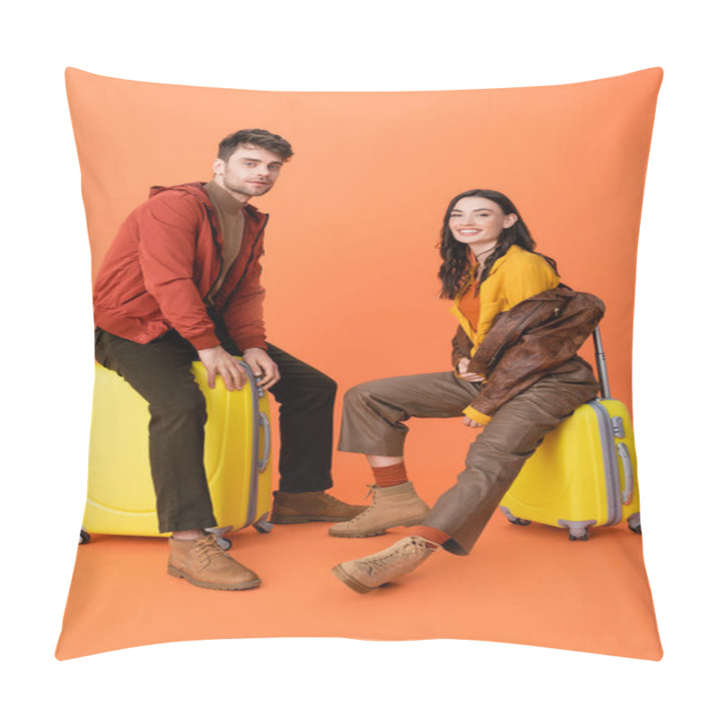 Personality  Joyful And Trendy Couple In Autumn Outfit Sitting On Yellow Baggage On Orange  Pillow Covers