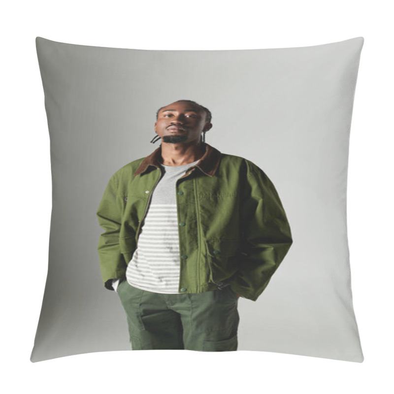 Personality  A Confident Young Man Poses In Fashionable Green Clothing Against A Clean Gray Backdrop, Exuding Elegance. Pillow Covers