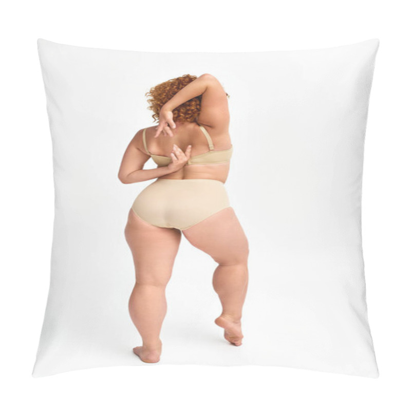 Personality  Back View Of Plus Size Model With Red Wavy Hair In Taupe Underwear With Hands Behind Back On White Pillow Covers