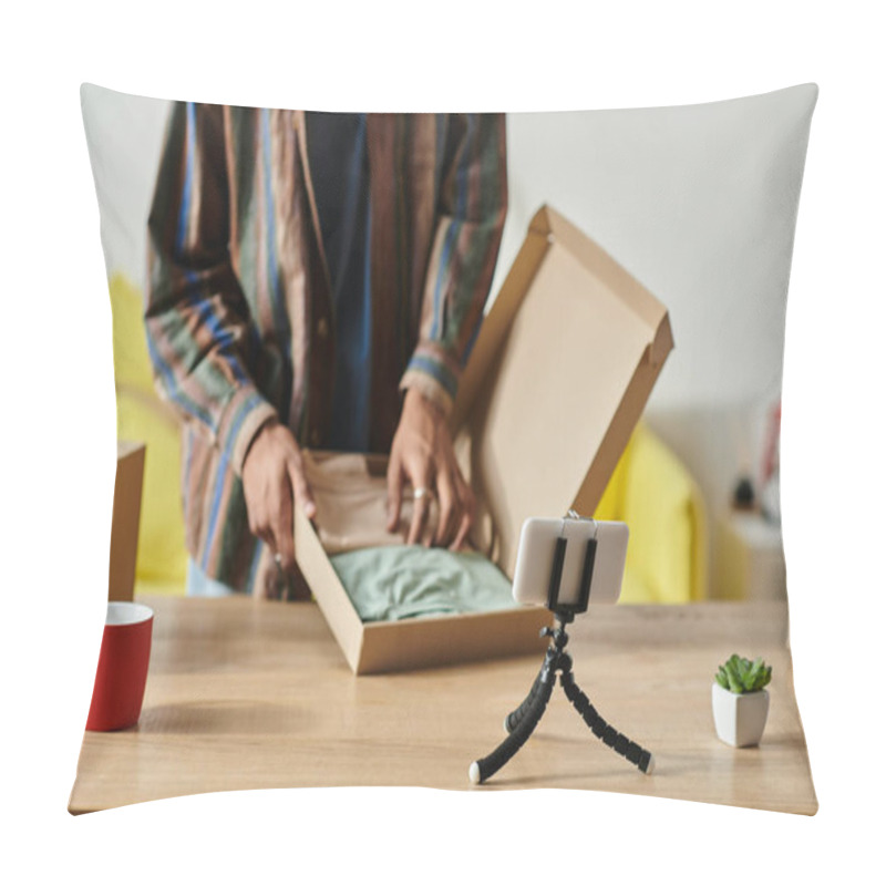 Personality  A Man Revealing The Contents Of A Box While Sitting At A Table. Pillow Covers