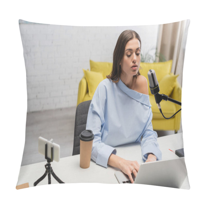 Personality  Brunette Broadcaster In Blouse Using Laptop Near Microphone, Smartphone On Tripod, Takeaway Coffee And Notebook On Table During Stream  In Studio  Pillow Covers