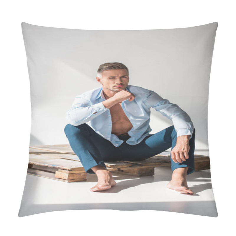 Personality  Handsome Adult Man Sitting On Wooden Pallet On White And Looking At Camera Pillow Covers