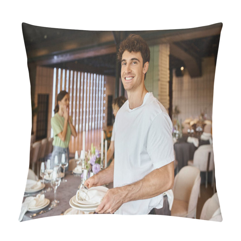 Personality  Smiling Event Manager With Plates And Napkins Looking At Camera Near Colleagues And Festive Table Pillow Covers