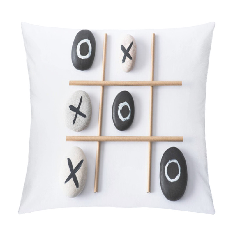 Personality  Top View Of Tic Tac Toe Game With Grid Made Of Paper Tubes, And Pebbles Marked With Naughts And Crosses On White Surface  Pillow Covers