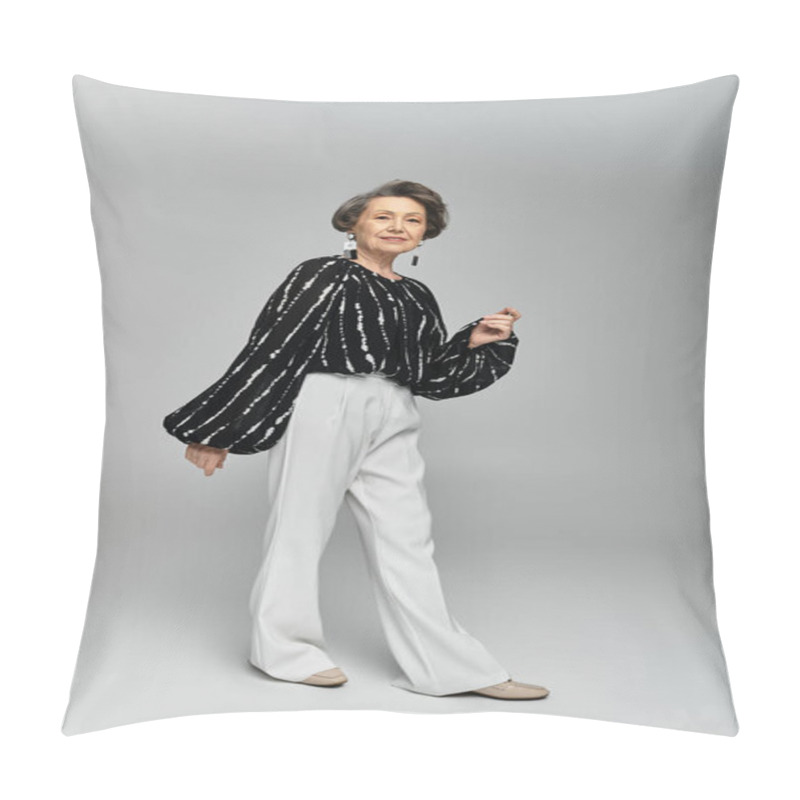 Personality  A Poised Woman In Her 60s Wears Elegant Attire, Exuding Confidence Against A Grey Backdrop. Pillow Covers