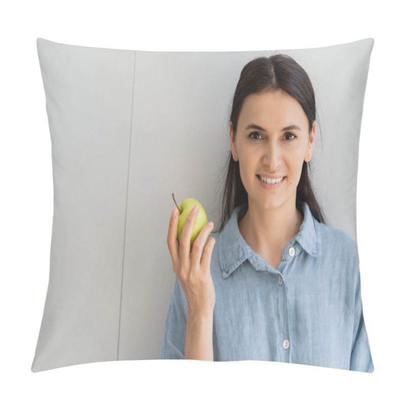 Personality  Smiling Brunette Woman In Shirt Holding Apple Near Wall  Pillow Covers