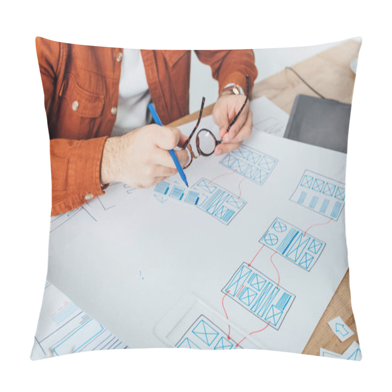 Personality  Cropped View Of Designer Holding Eyeglasses And Marker Near Templates Of User Experience Design On Table Isolated On Grey Pillow Covers