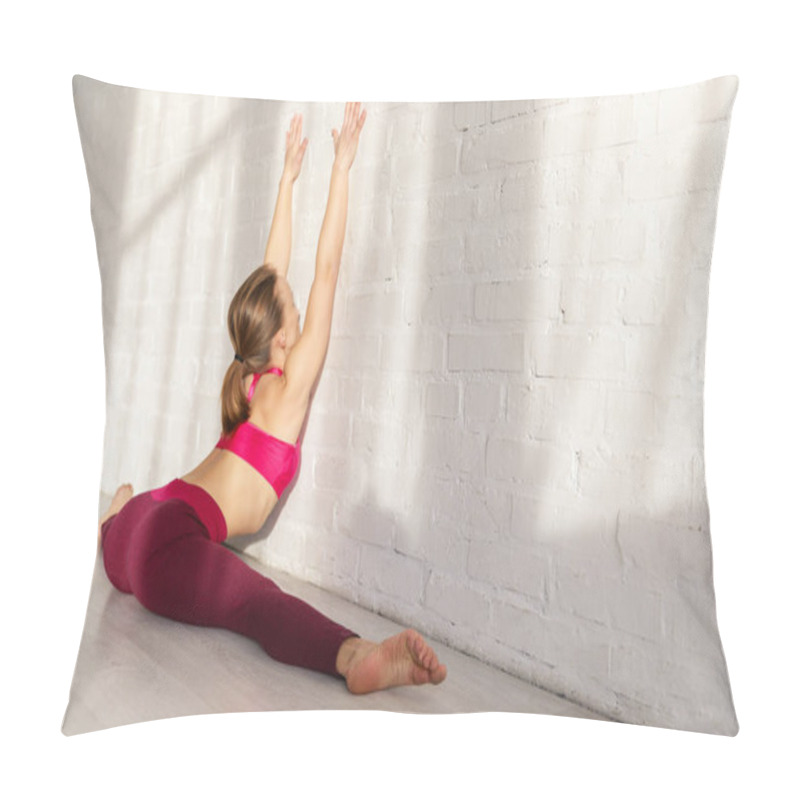 Personality  Flexible Young Woman Doing Twine Stretching Near Brick Wall In Yoga Studio  Pillow Covers