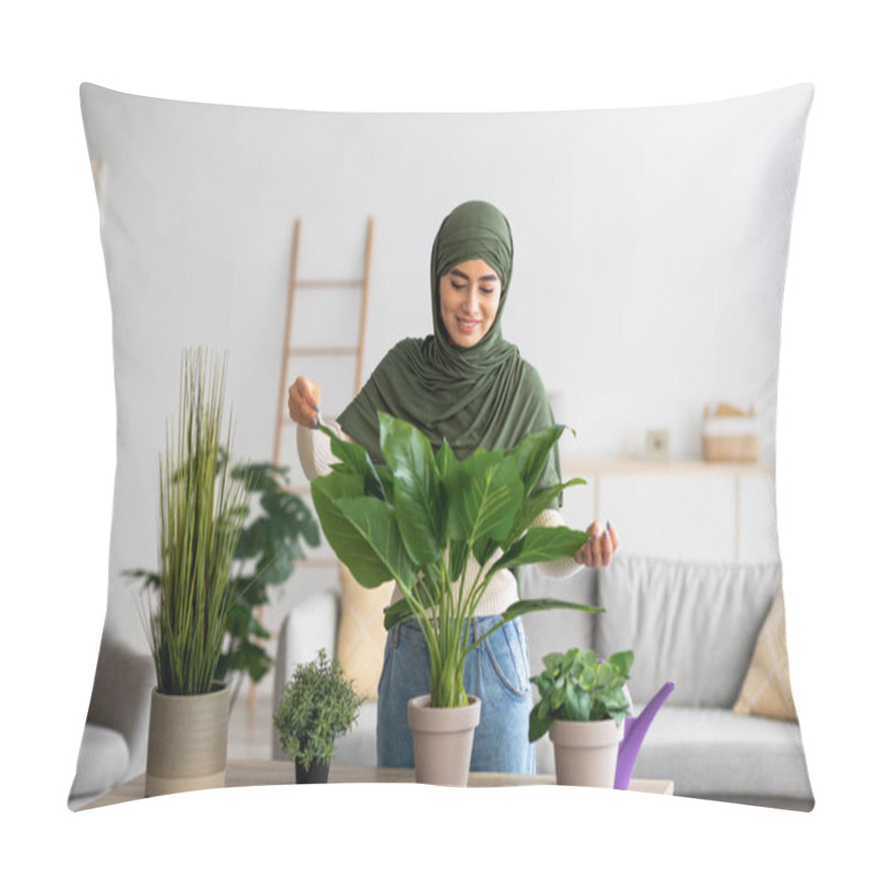 Personality  Portrait Of Cheery Young Arab Woman In Hijab Taking Care Of Houseplants Indoors. Gardening, Domestic Environment Pillow Covers