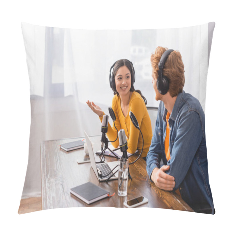 Personality  Asian Announcer In Wireless Headphones Gesturing While Talking To Colleague In Radio Studio Pillow Covers