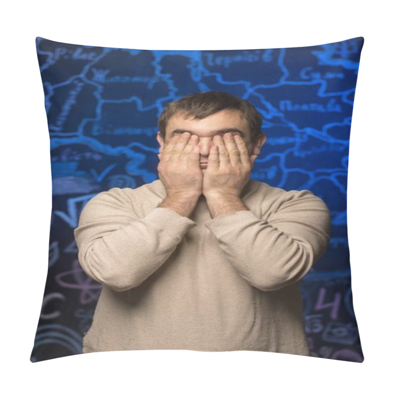 Personality  A Young Man In A Beige Sweater Covers His Face With His Hands Against A Background Of A Blue Map. A Concept Of Emotions, Stress, Or Introspection Captured In A Studio Setting Pillow Covers