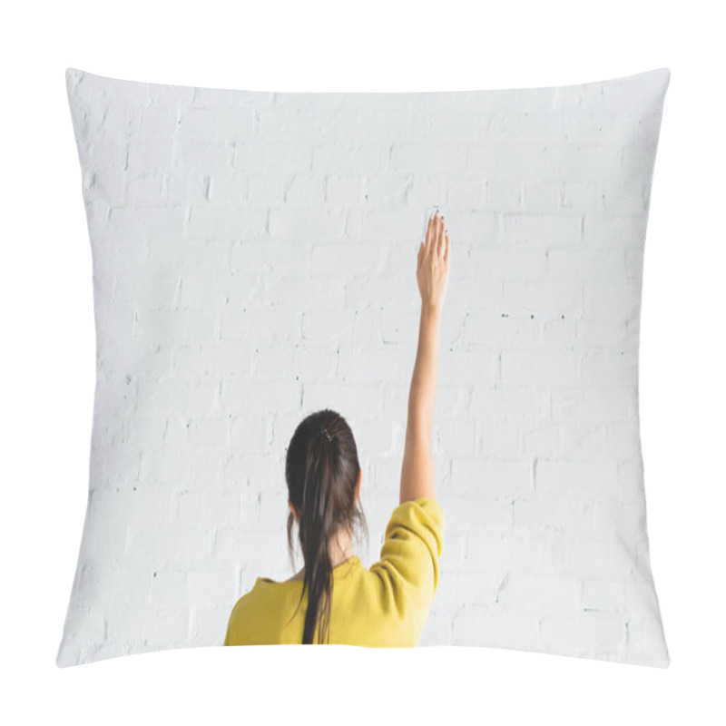 Personality  Back View Of Woman Voting With Hand In Air Against White Brick Wall Pillow Covers