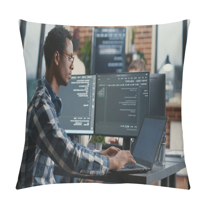 Personality  Portrait Of African American Developer Using Laptop To Write Code Sitting At Desk With Multiple Screens Parsing Algorithm In Software Agency. Coder Working On User Interface Using Portable Computer. Pillow Covers