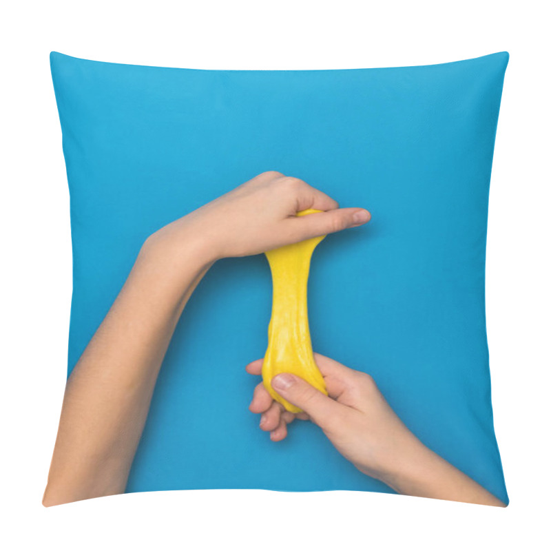 Personality  Bright Yellow Slime Stretched Out In The Hands On A Bright Blue Background. Pillow Covers