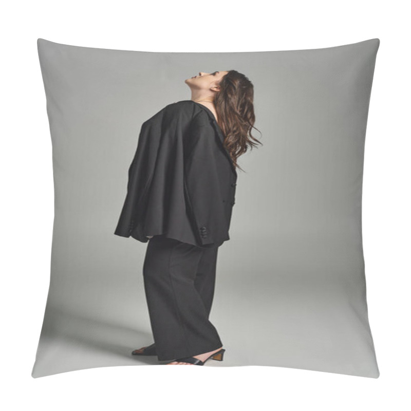 Personality  A Beautiful Plus Size Woman Strikes A Pose In A Stylish Black Suit And Heels Against A Gray Backdrop. Pillow Covers