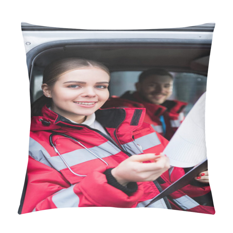 Personality  Smiling Young Female Paramedic Holding Clipboard And Looking At Camera Pillow Covers