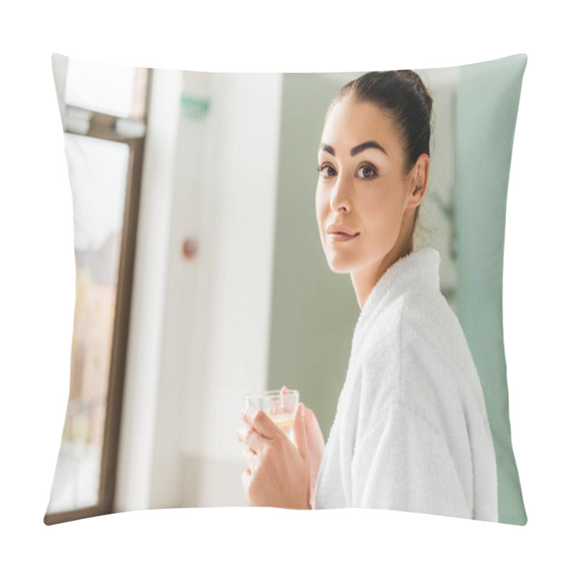 Personality  Attractive Young Woman In Bathrobe Holding Cup Of Herbal Drink And Looking At Camera In Spa Pillow Covers