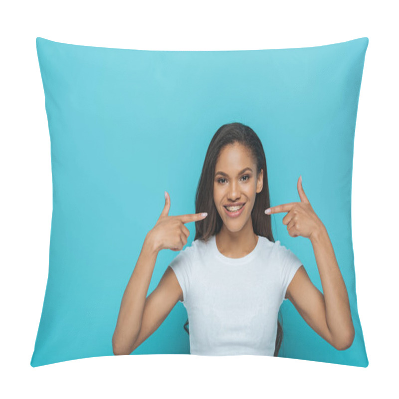 Personality  Happy African American Girl Smiling At Camera While Pointing At Braces On Her Teeth On Blue Background Pillow Covers