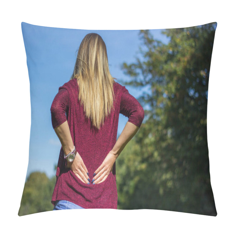 Personality  Woman With Back Pain In The Public Park. Young Woman Rubbing Aching Back Pillow Covers