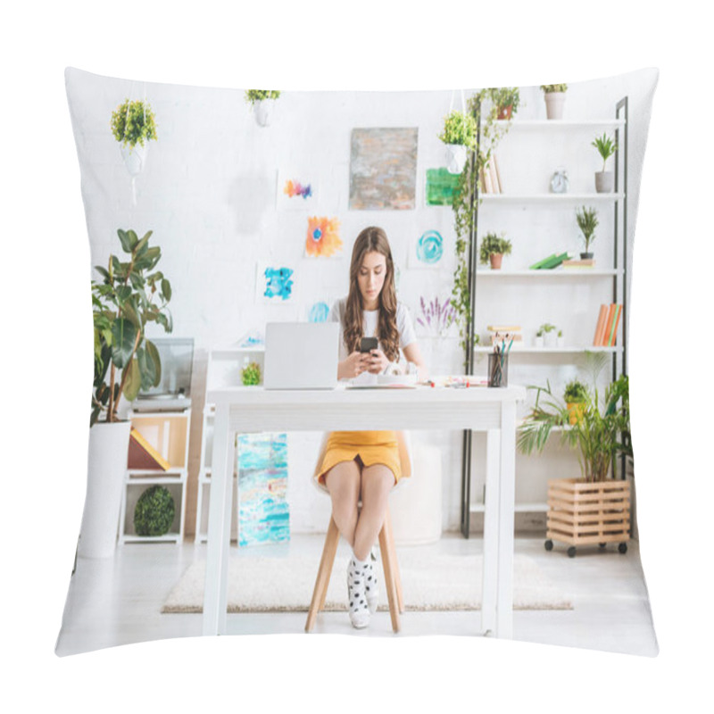 Personality  Young Woman Using Smartphone While Sitting At Desk With Laptop In Spacious Room At Home Pillow Covers