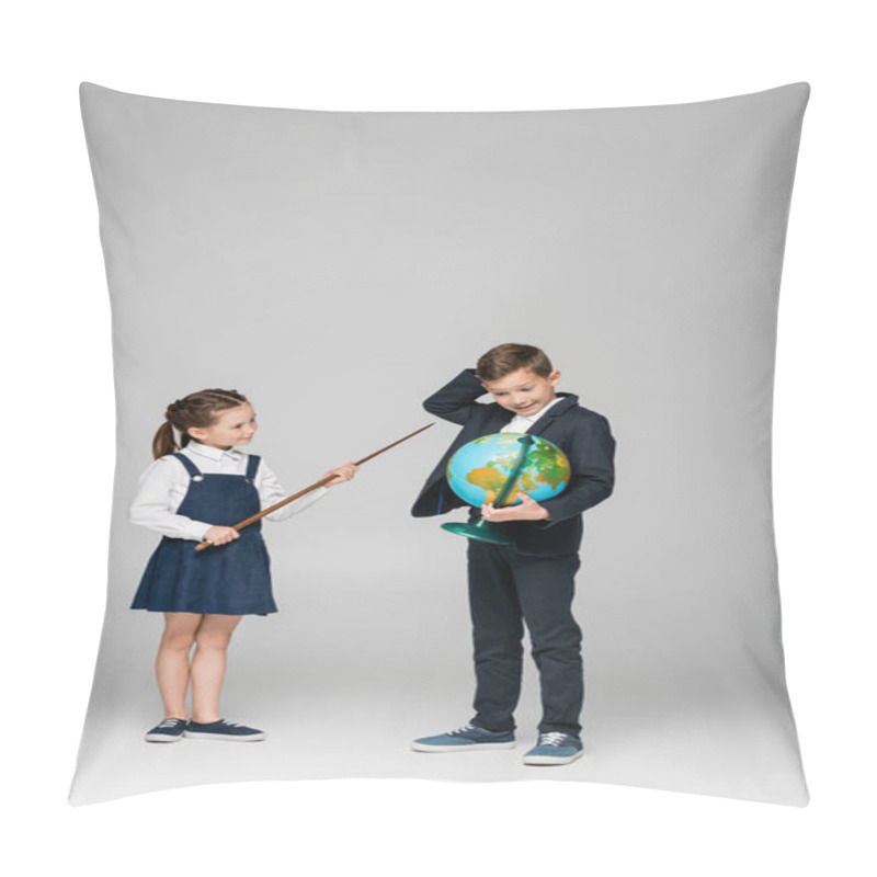 Personality  Smiling Schoolgirl Holding Pointing Stick Near Confused Boy With Globe On Grey  Pillow Covers