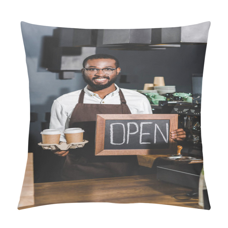 Personality  Young African American Barista In Eyeglasses Holding Sign Open And Disposable Paper Cups, Smiling At Camera In Coffee Shop Pillow Covers