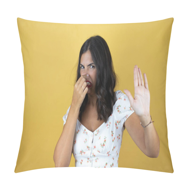 Personality  Beautiful Woman Over Yellow Background Smelling Something Stinky And Disgusting, Intolerable Smell, Holding Breath With Fingers On Nose Pillow Covers