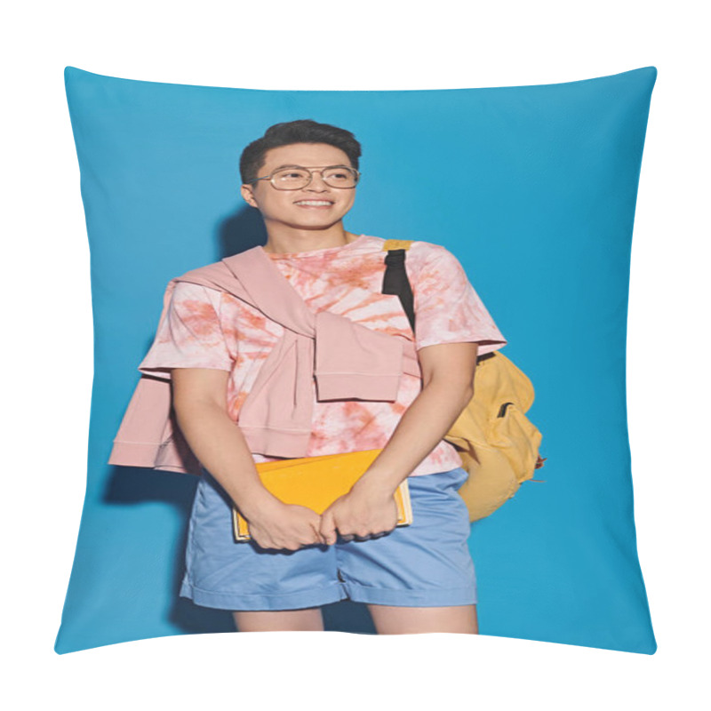 Personality  A Stylish Young Man Poses Energetically In A Trendy Outfit Against A Blue Backdrop. Pillow Covers