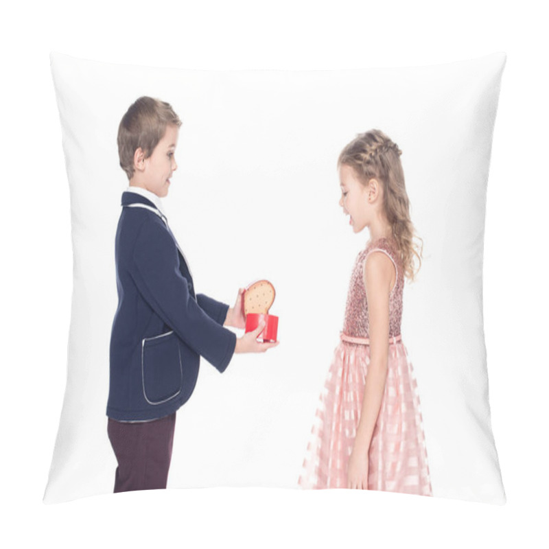 Personality  Side View Of Stylish Boy Opening And Presenting Heart Shaped Gift Box To Surprised Little Girl Isolated On White  Pillow Covers