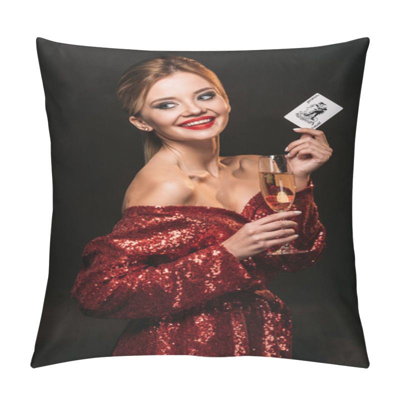 Personality  Smiling Attractive Girl In Red Shiny Dress Holding Joker Card And Glass Of Champagne Isolated On Black, Looking Away Pillow Covers