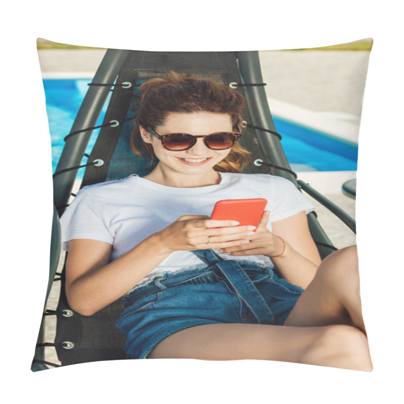 Personality  Smiling Young Woman Using Smartphone While Relaxing On Sun Lounger In Front Of Swimming Pool Pillow Covers