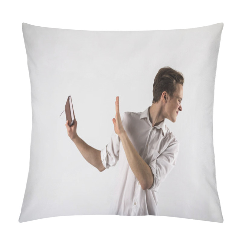 Personality  Young Man Holding Workbook In His Hands. Guy With Glasses. Dislike And Refuse Concept. Pillow Covers