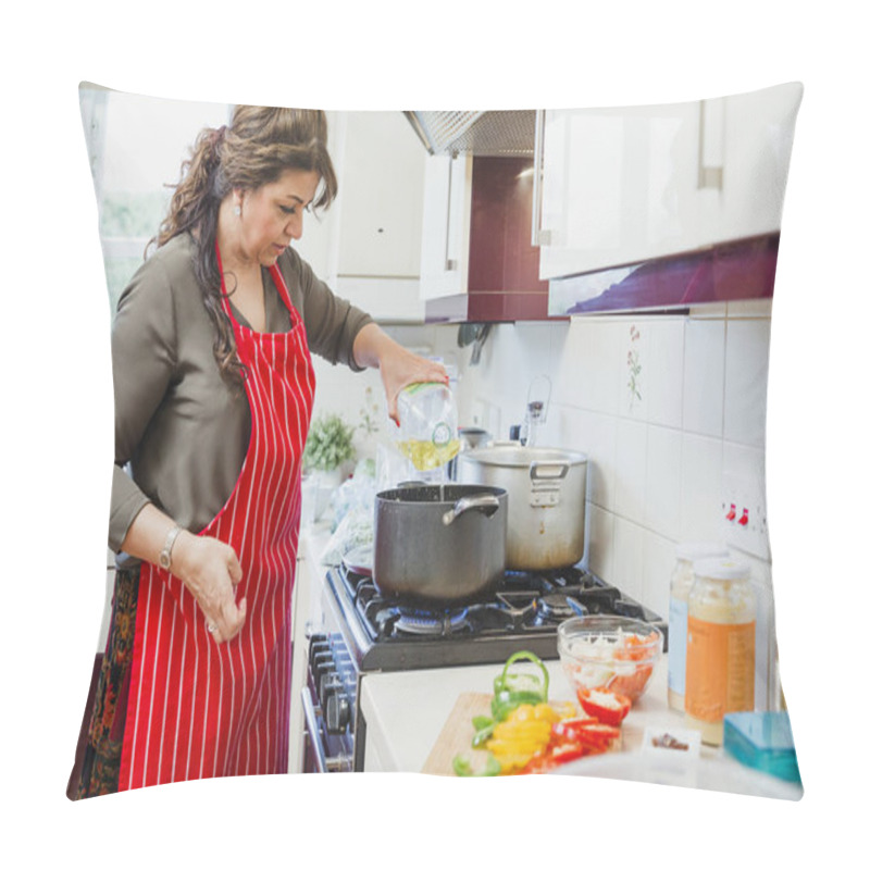 Personality  Mature Woman Is Cooking A Curry In The Kitchen Of Her Home. She Is Adding Oil To A Pan.  Pillow Covers