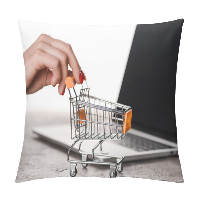 Personality  Cropped View Of Woman Holding Toy Shopping Cart Near Laptop Isolated On White, E-commerce Concept Pillow Covers