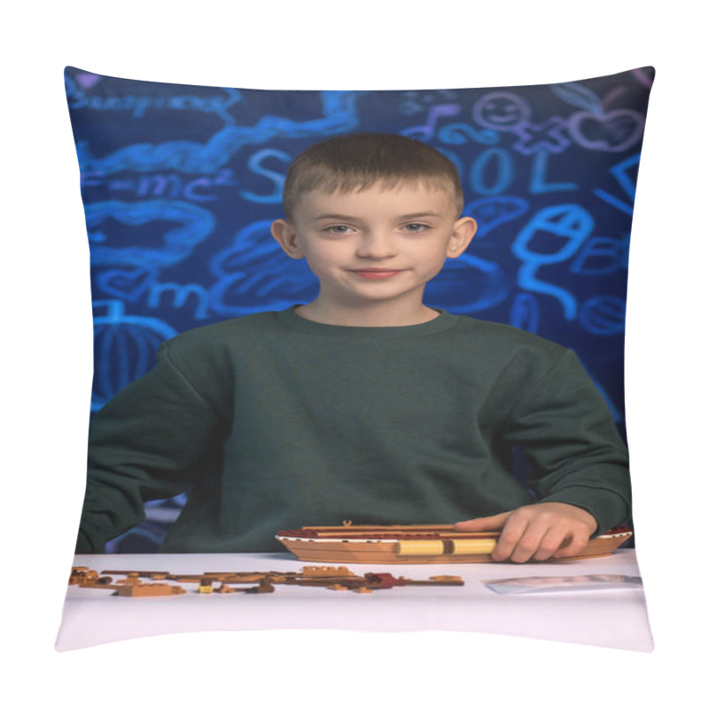 Personality  Young Boy Assembling A Wooden Model Ship With Focus And Concentration, Surrounded By Scattered Parts, Representing Creativity And Hands-on Learning In A Classroom Environment Pillow Covers