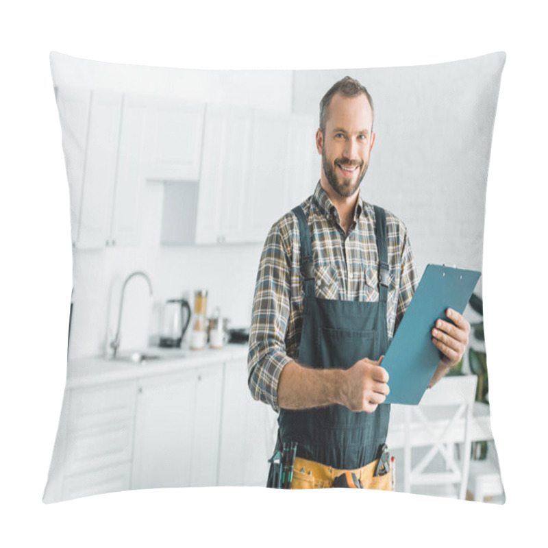 Personality  Smiling Handsome Plumber Holding Clipboard And Looking At Camera In Kitchen Pillow Covers