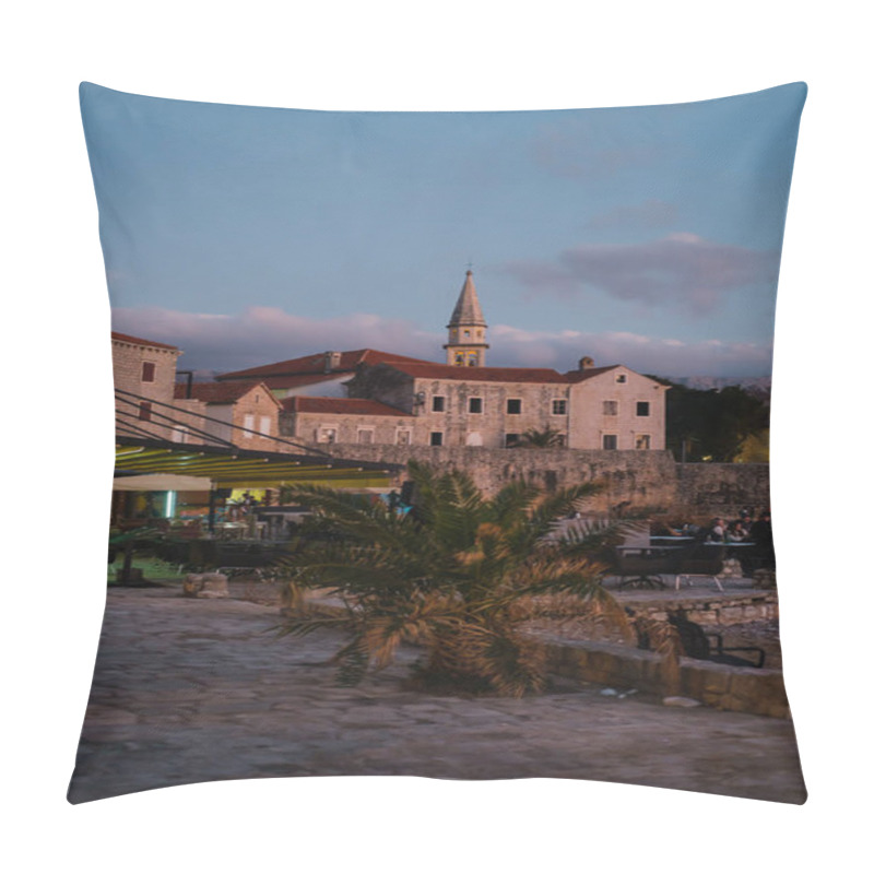 Personality  A Picturesque Coastal Town At Dusk Featuring Historic Stone Buildings, A Church Tower With Warm Lights, And An Outdoor Dining Area.  Pillow Covers