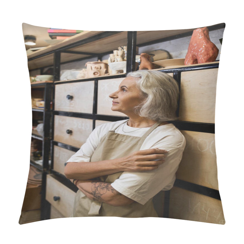 Personality  In A Pottery Workshop, A Mature Woman Reflects On Her Artistic Journey Amid Crafted Pieces. Pillow Covers