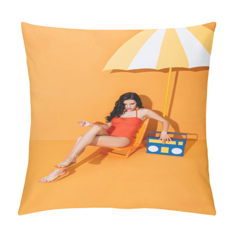 Personality  Young Woman In Swimsuit Touching Paper Boombox While Sitting On Deck Chair Near Umbrella On Orange Pillow Covers