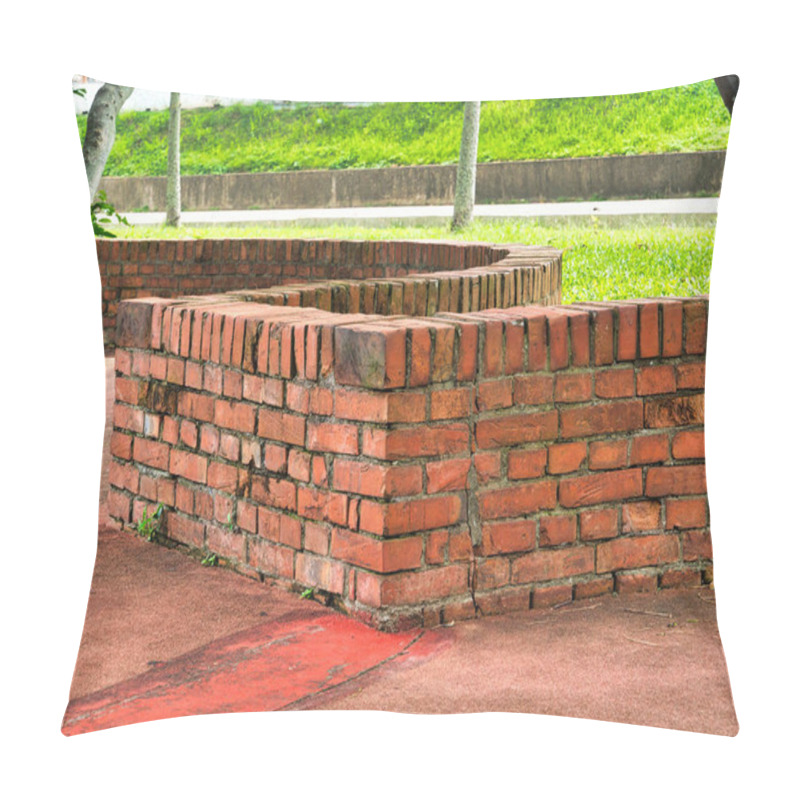 Personality  Curved Brick Benches And Concrete Seats Rest Under The Shade Of Leafy Trees On A Red-paved Surface Surrounded By Lush Green Grass. Pillow Covers