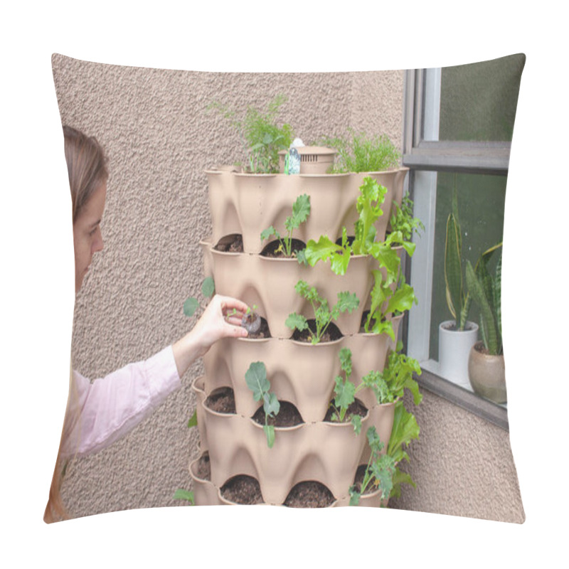 Personality  A Young Blonde Woman Is Planting A Vertical Tower Garden With Herbs And Vegetables On Her Apartment Patio, In The Early Spring. She Is Holding A Small Starter, Ready To Plant It.  Pillow Covers