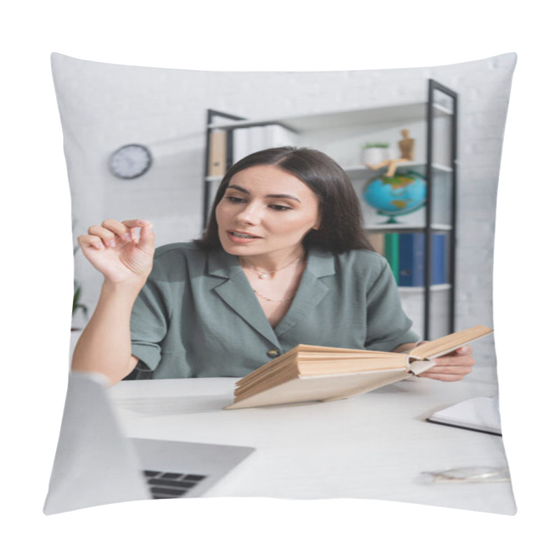 Personality  Teacher With Book Talking During Online Lesson On Laptop In School  Pillow Covers