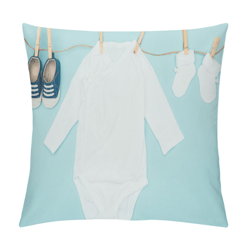 Personality  Top View Of Baby Clothes Drying On Rope Isolated On Blue Pillow Covers