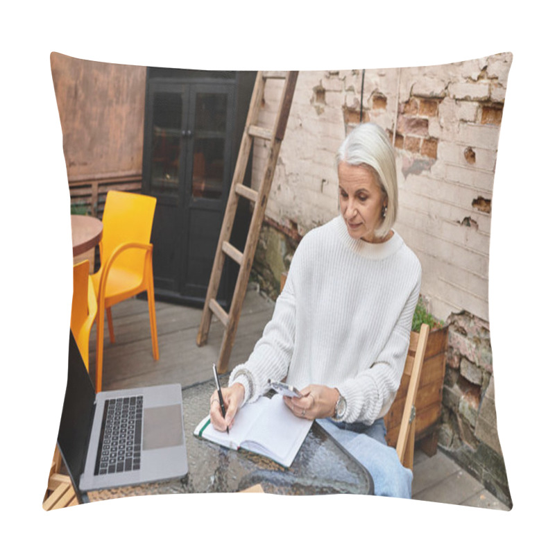 Personality  A Thoughtful Woman With Gray Hair Enjoys Writing In Her Notebook At A Charming Outdoor Setting. Pillow Covers