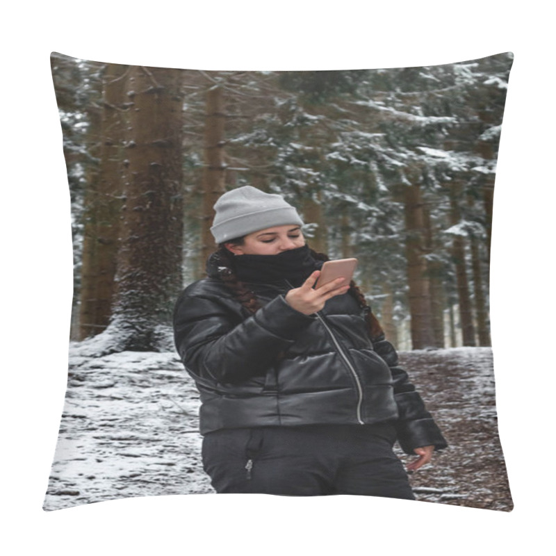 Personality  Young Woman Using The Smart Phone In A Snowy Forest In Denmark Using Warm Clothes Pillow Covers