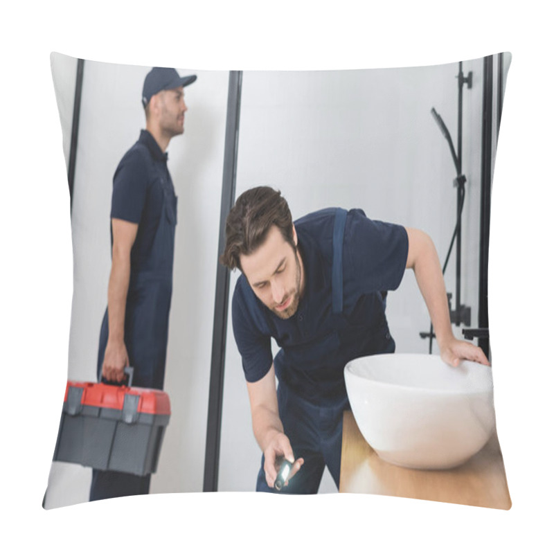 Personality  Plumber With Flashlight Checking Sink In Bathroom Near Blurred Colleague With Toolbox Pillow Covers