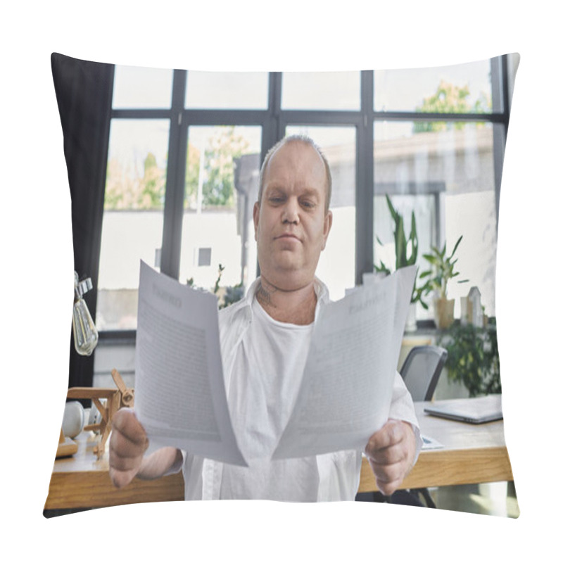 Personality  A Man With Inclusivity Sits At A Desk In A Well-lit Office, Carefully Reviewing Documents. Pillow Covers