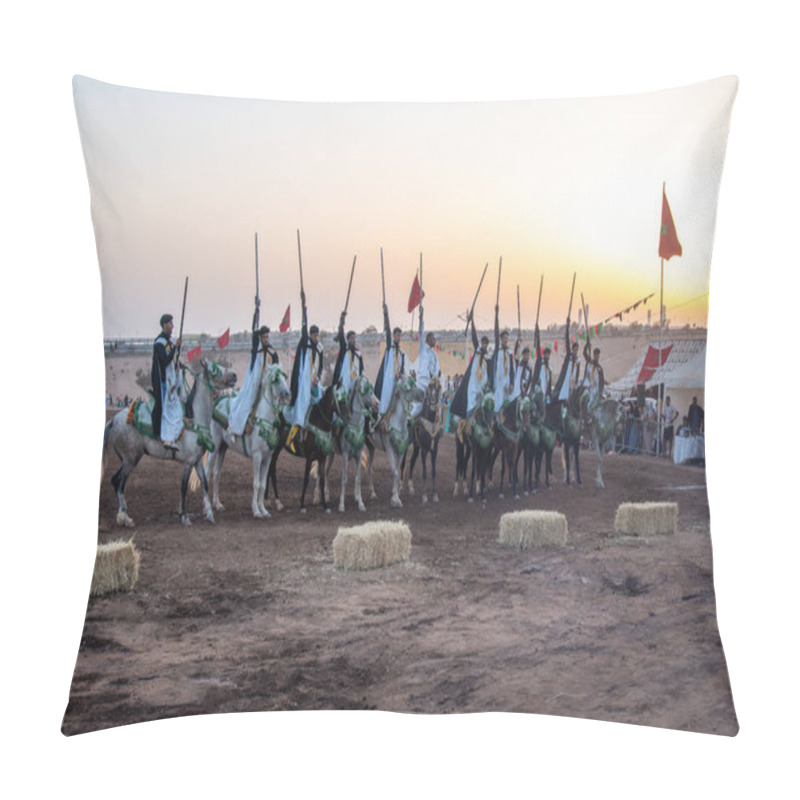 Personality  Agadir, Souss-Massa - Morocco - 08-03-2024: Berber Riders In Formation On Decorated Horses With Rifles, Flags Waving In The Background At Sunset, Creating A Festive Atmosphere. Pillow Covers