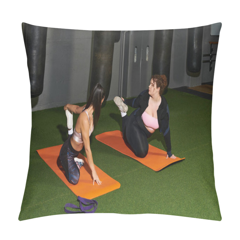 Personality  Two Women Are Dedicatedly Practicing Stretch Exercises On Yoga Mats In A Gym Setting. Pillow Covers