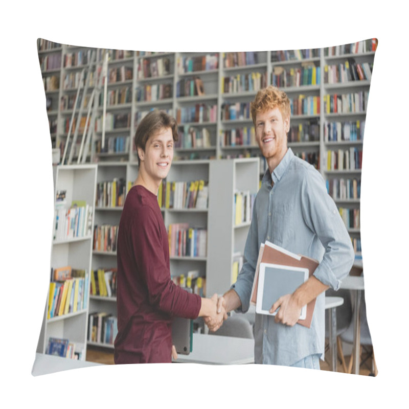 Personality  Two Young Men Shake Hands In A Quiet Library, Surrounded By Books And Studying Materials. Pillow Covers